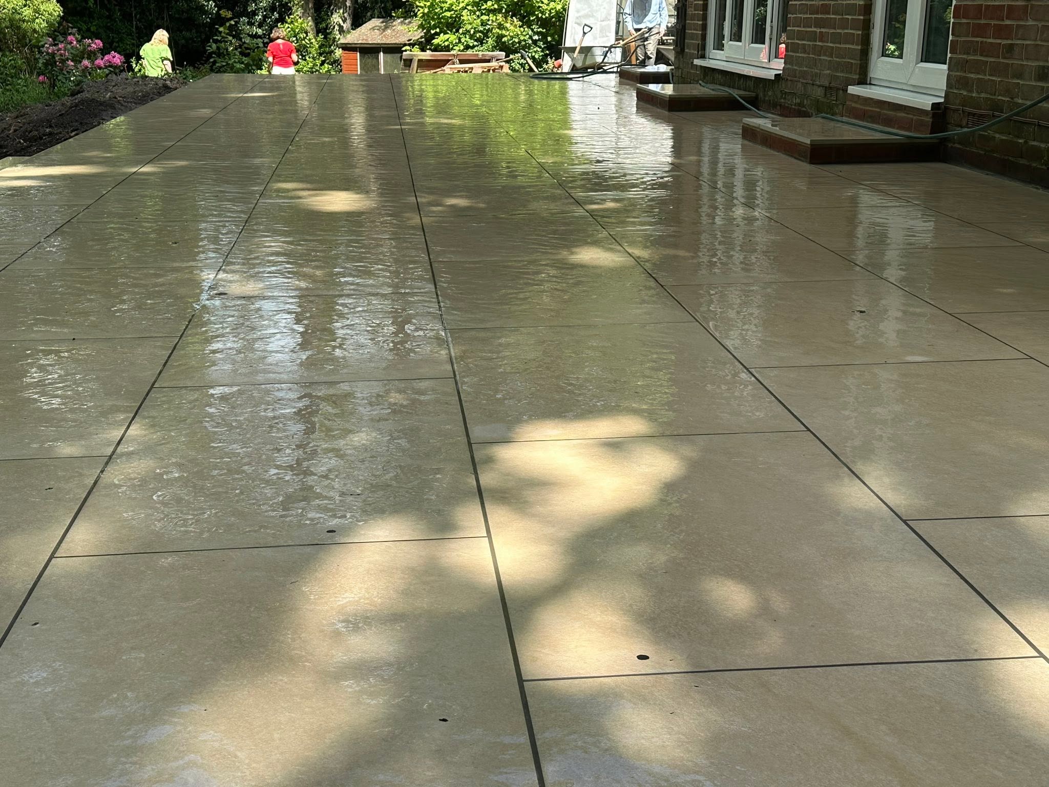 Large-format porcelain patio, freshly laid