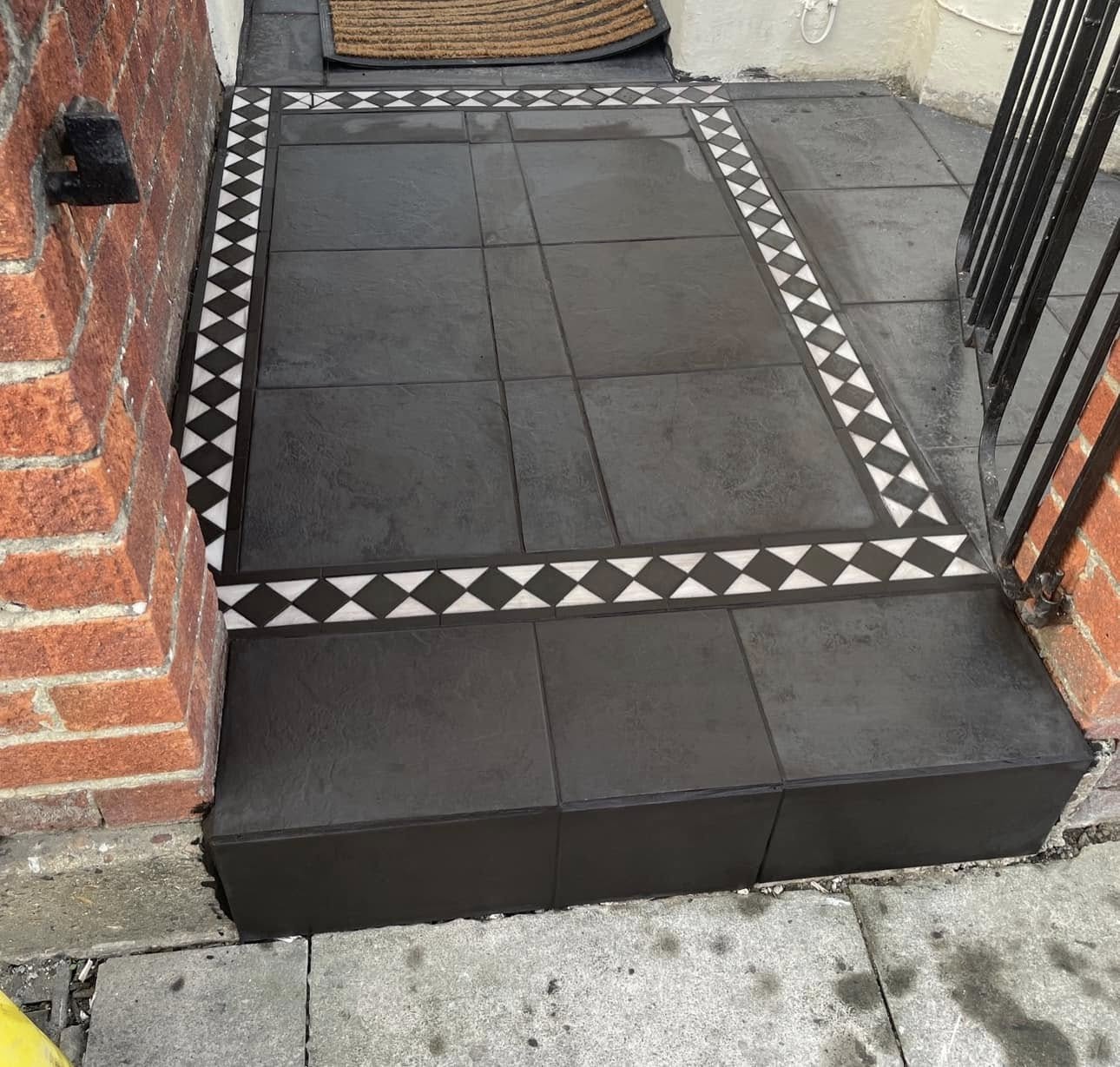 Front step tiled with patterned border